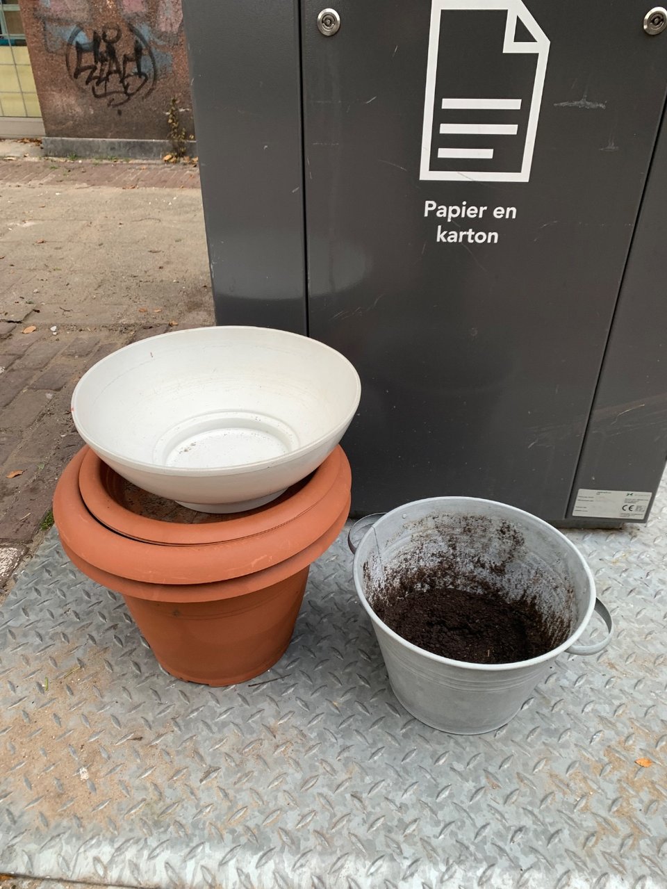 Two large plant pots
One large ceramic plate
One metal bucket