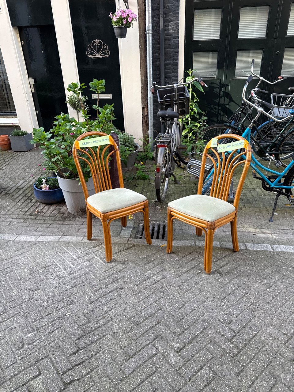 Two cute chairs, one with a stain on the seat