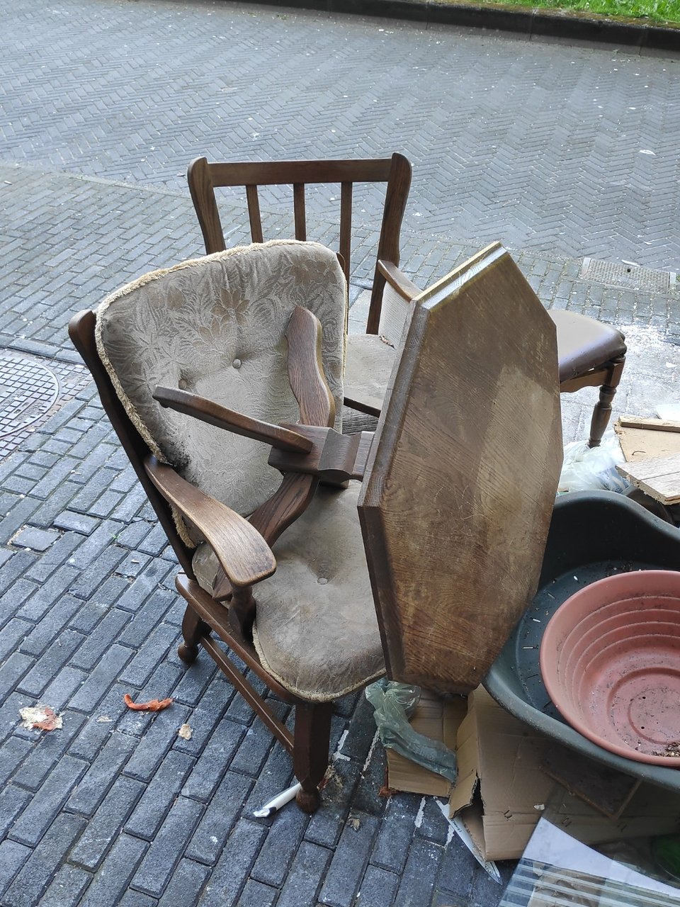 2 single wooden couches and octogonal table. The wooden structure is still in good condition