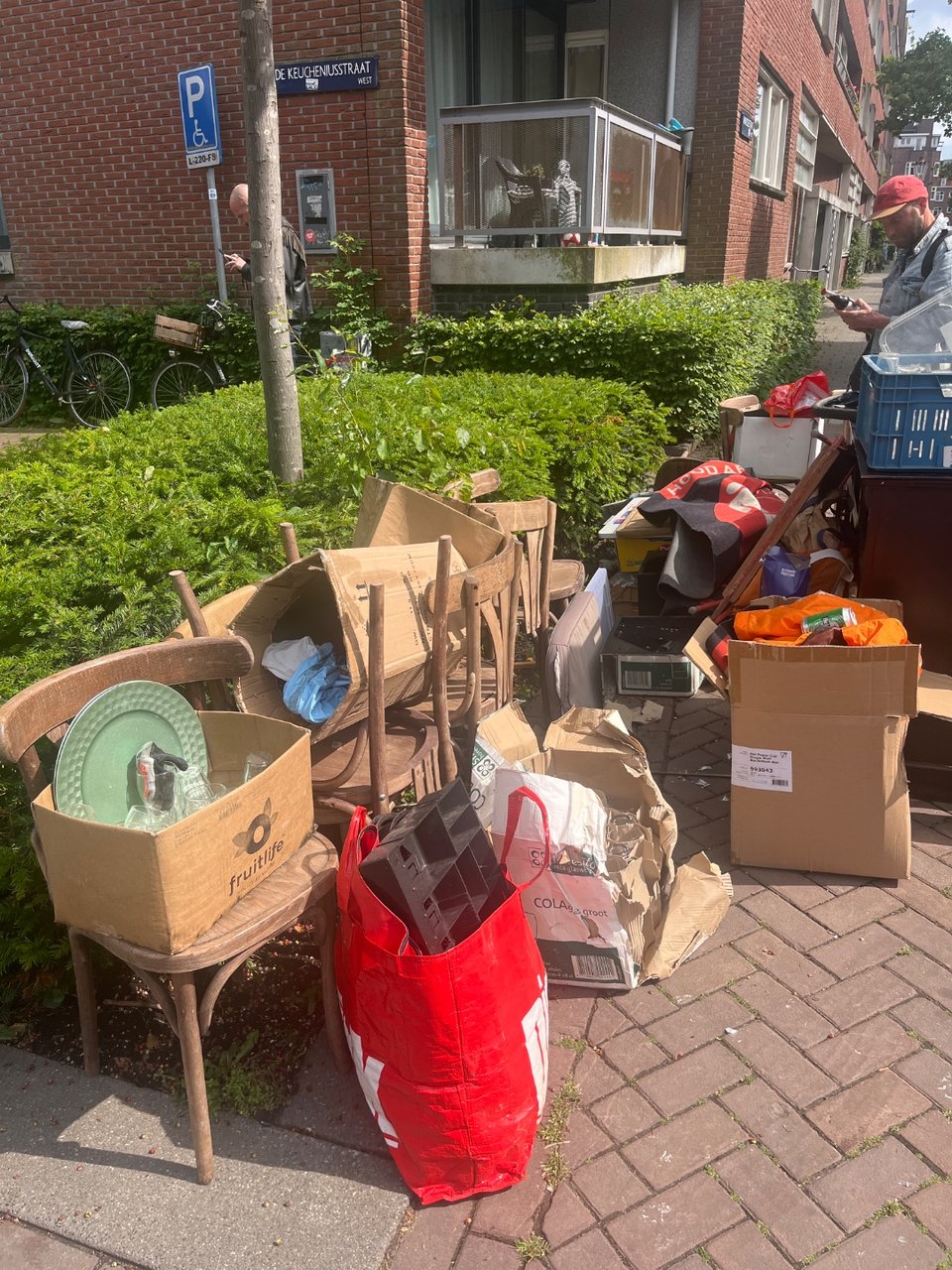 Many wooden chairs and other smaller items (cups, trays, blackboard)