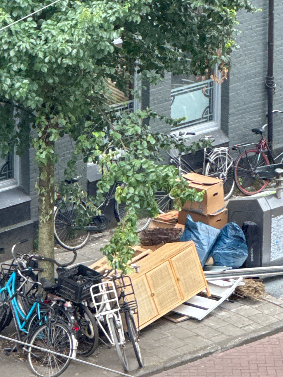 Sorry for the pic from afar, but there is a gorgeous cabinet with webbing waiting for a new home