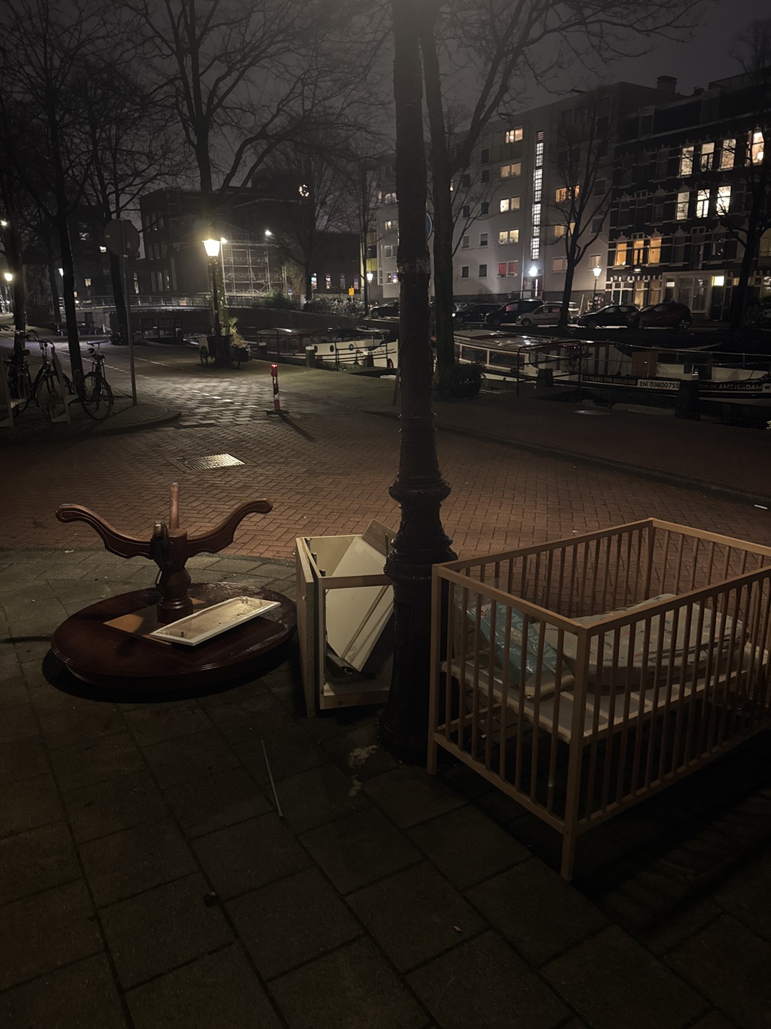 Table, some shelving and a crib