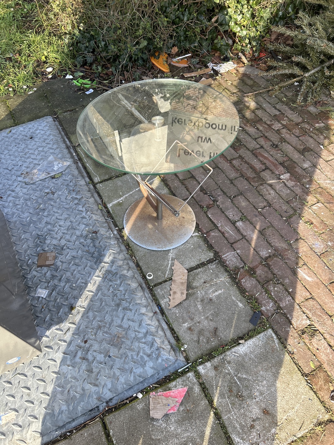 Glass table with magazine holder