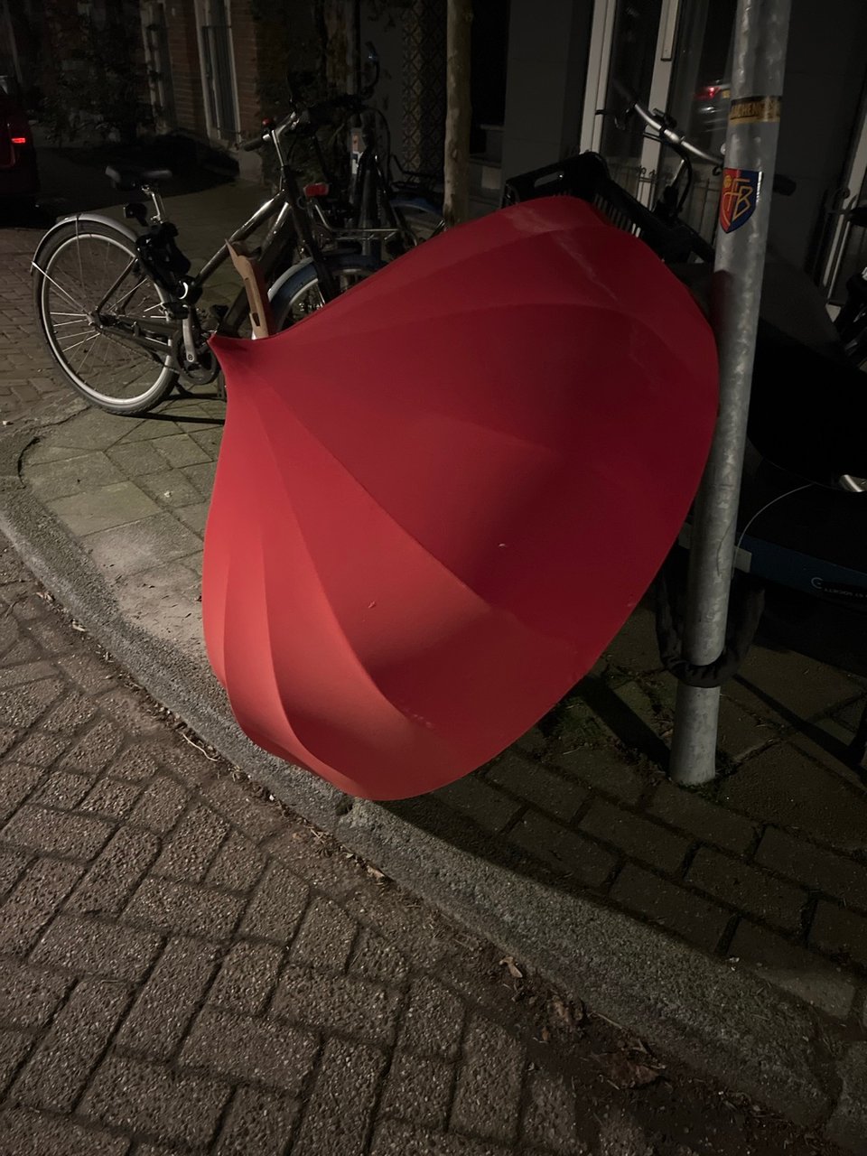 Huge beautifull lamp from red fabric, inside is silver ligned. Grensstraat nr 31 oost vlakbij Amstel