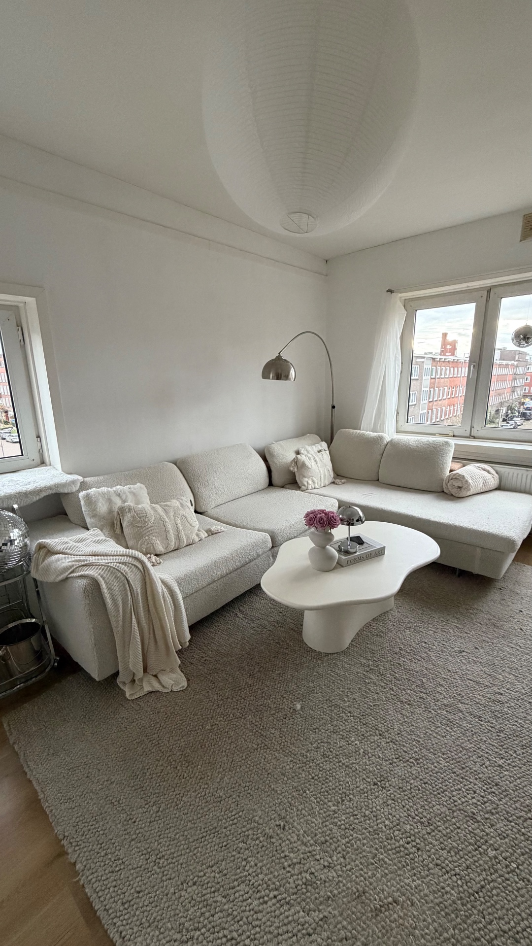 This Roche Bobois couch is up for taking! We wrapped it ourselves with a white teddie material, the original couche is brown/sand color. There are some damages on the side and bottom caused by our cat, but nothing noticeable if placed against a wall :) perfect for a student house