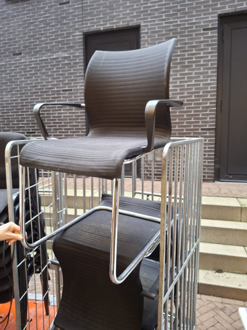 A container full of office furniture! Take what want but remove it carefully from the container 😊