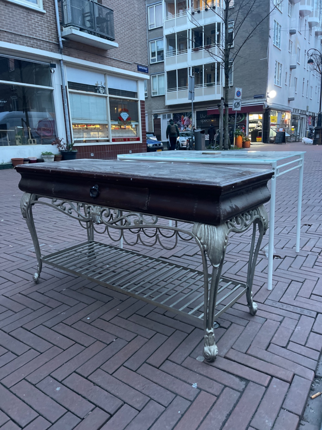 2 side tables one metal and glass, the other one metal and leather