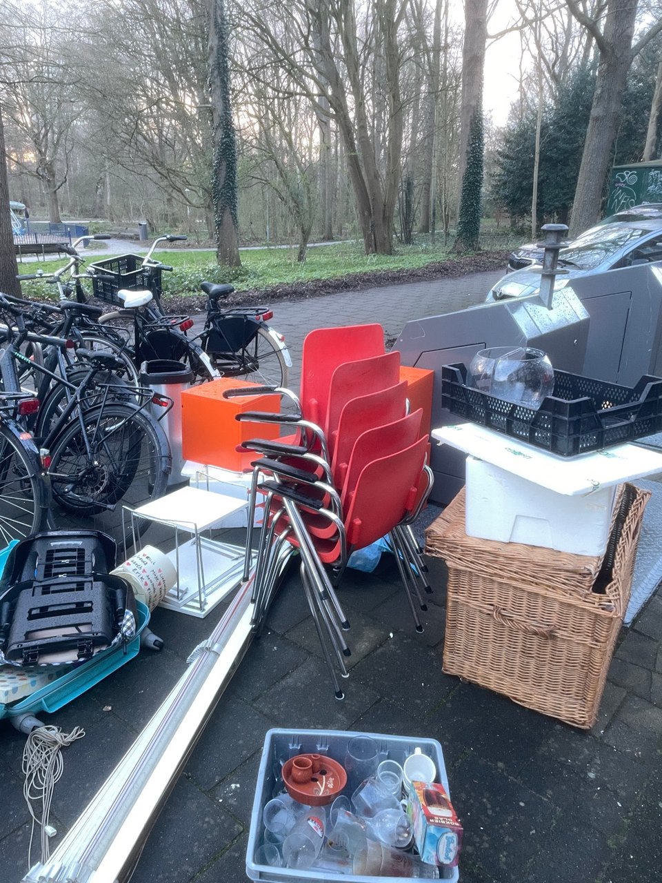 Red chairs and orange storage cabinets and big basket