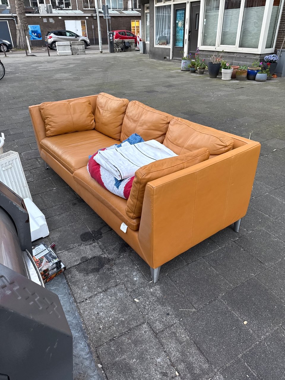 Really good looking leather couch, complete with all the cushions