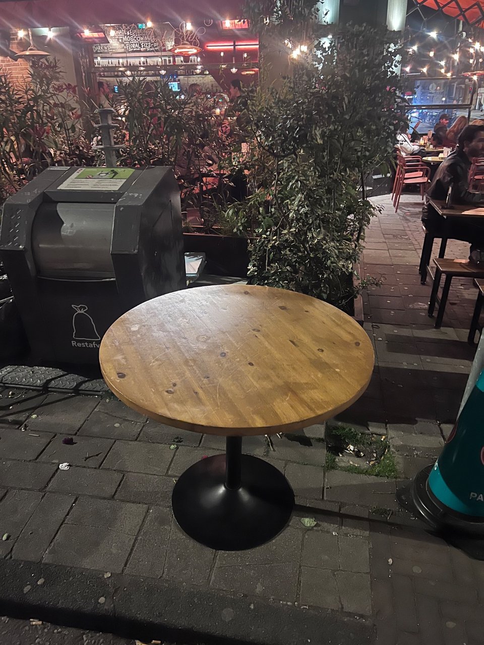 Small round wooden dinner table. No visible damage.