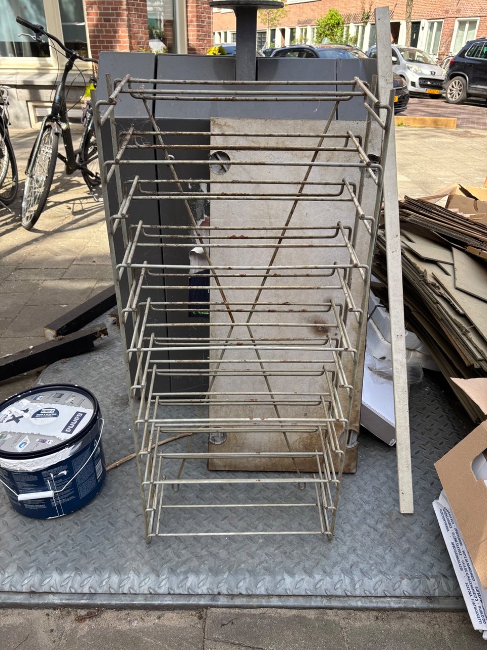 Shoe rack? Definitely old, indestructable/ solid steel. Needs refinishing.