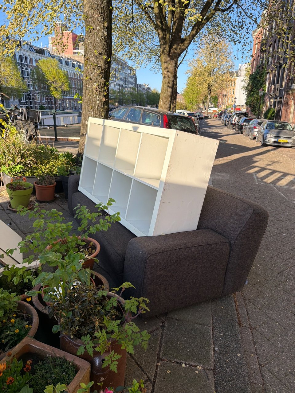 Shelves (IKEA kallax), sofa, 2x chairs, table, lamp