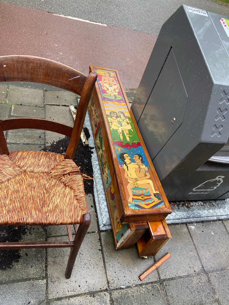 Wooden chair, and interesting (kamasutra?) light boxes.